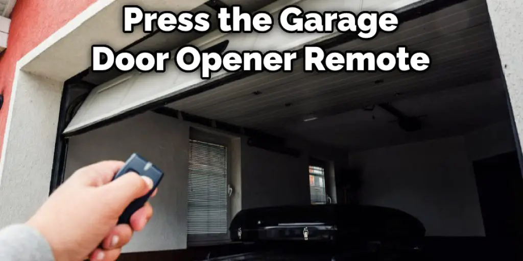  Press the Garage Door Opener Remote