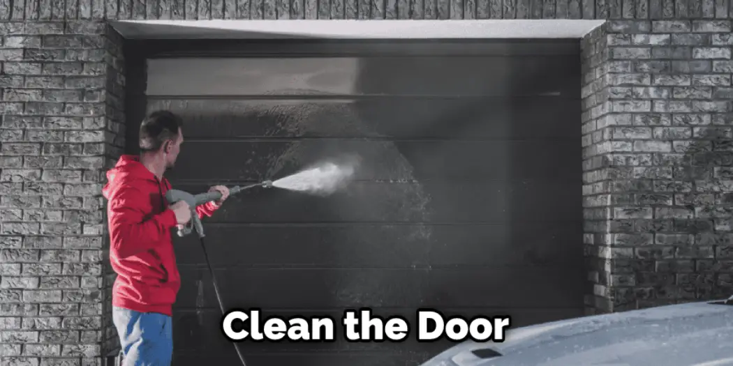 How To Paint Metal Garage Door 2023   Clean The Door 