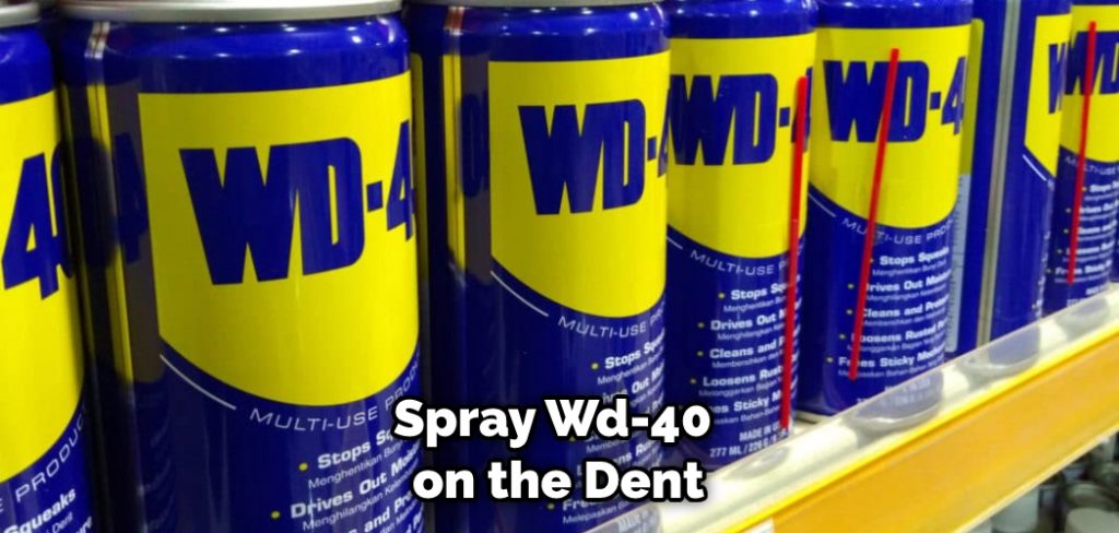 Spray Wd-40 on the Dent