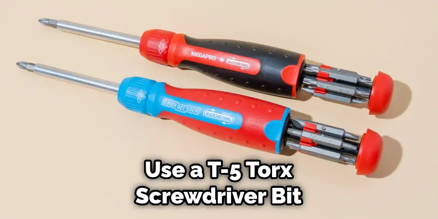Use a T-5 Torx Screwdriver Bit