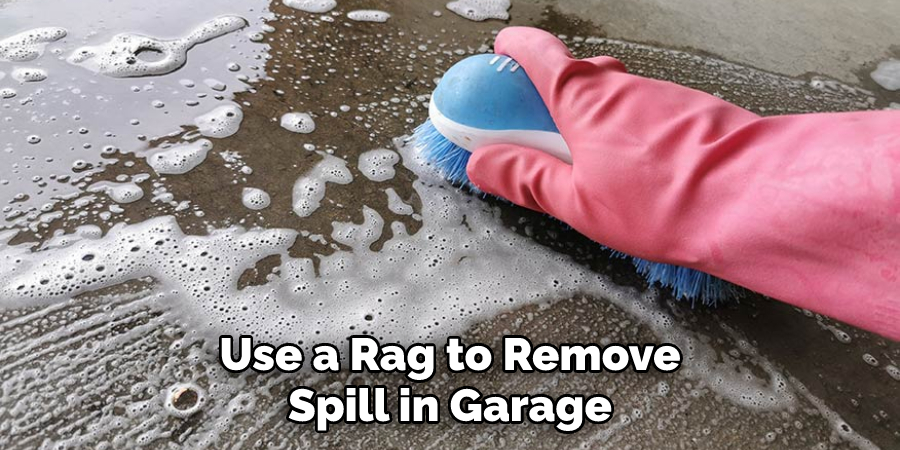 Use a Rag to Remove Spill in Garage
