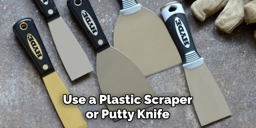 Use a Plastic Scraper or Putty Knife
