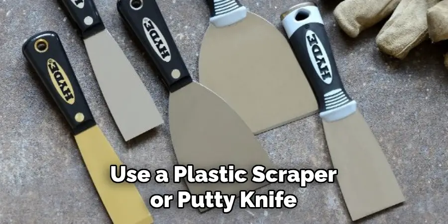 Use a Plastic Scraper or Putty Knife