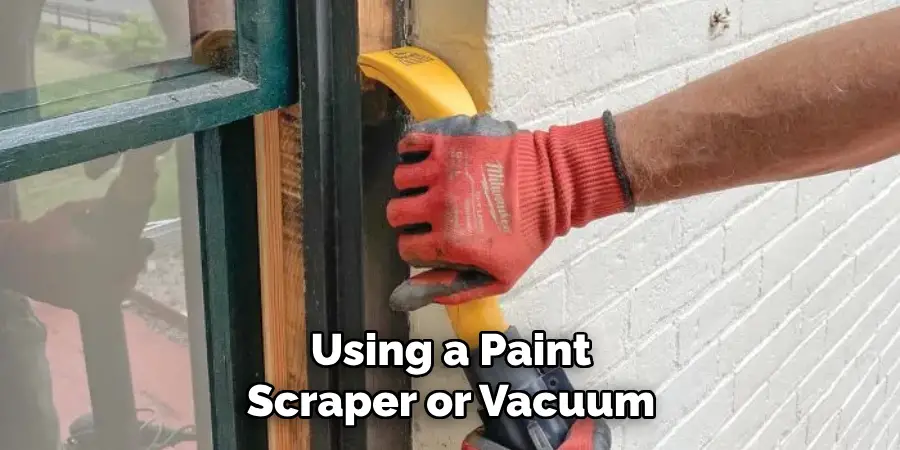 Using a Paint Scraper or Vacuum