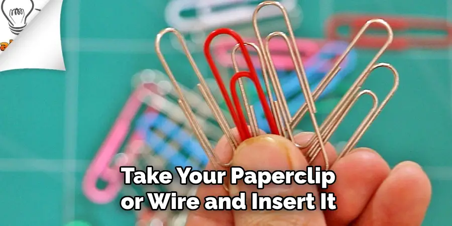  Take Your Paperclip or Wire and Insert It