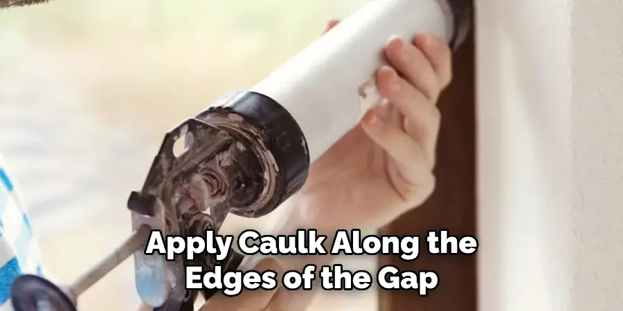 Apply Caulk Along the Edges of the Gap