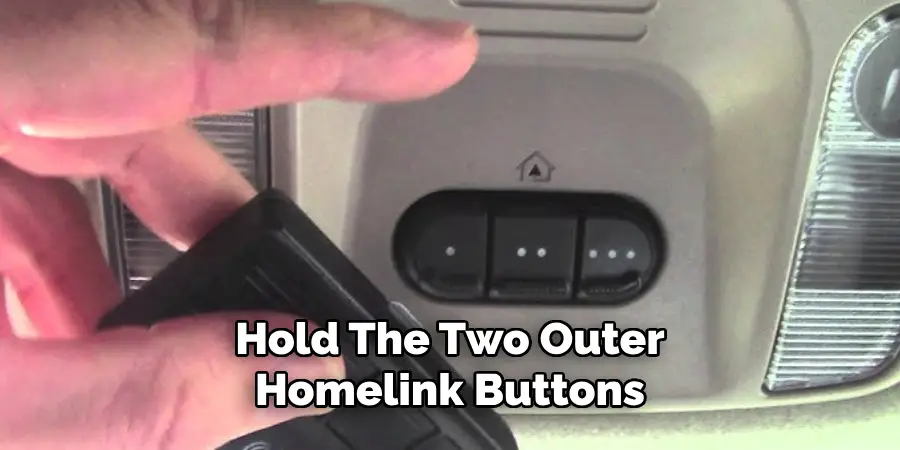 Hold the Two Outer Homelink Buttons 