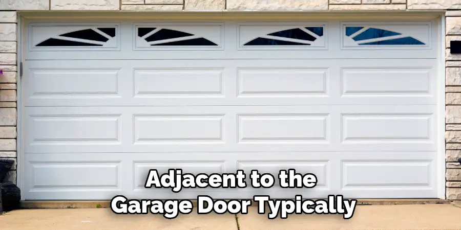 Adjacent to the Garage Door Typically