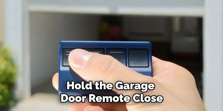 Hold the Garage Door Remote Close