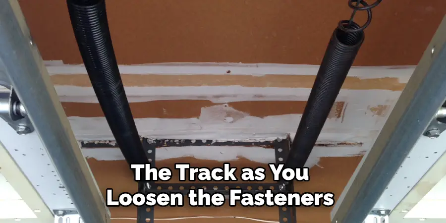 The Track as You Loosen the Fasteners