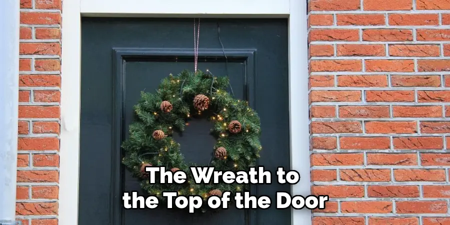 The Wreath to the Top of the Door