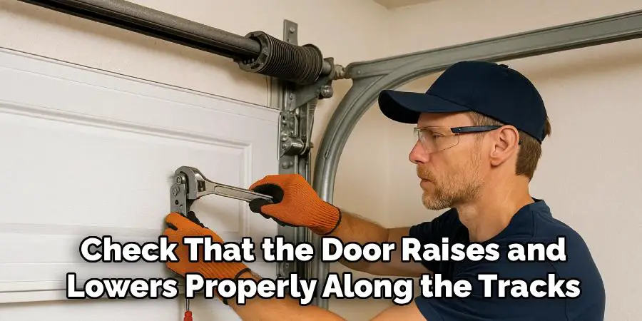 Check That the Door Raises and
Lowers Properly Along the Tracks