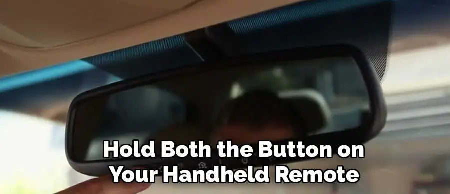 Hold Both the Button on
Your Handheld Remote