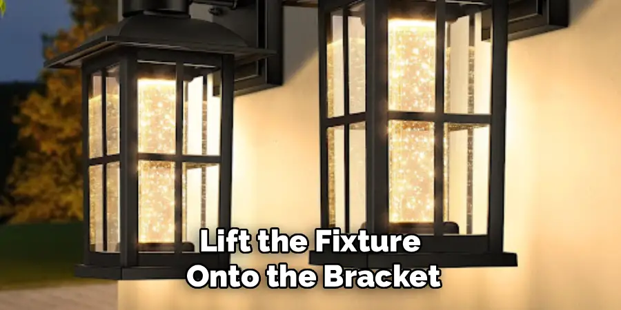 Lift the Fixture 
Onto the Bracket