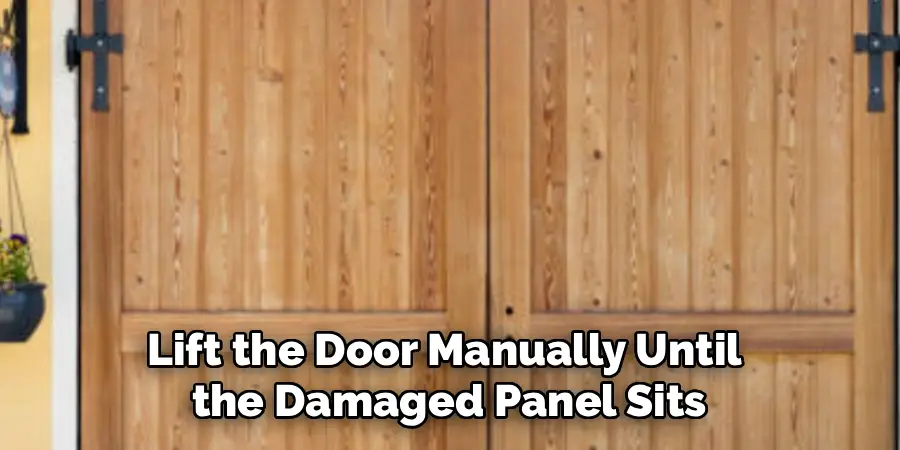 Lift the Door Manually Until 
the Damaged Panel Sits