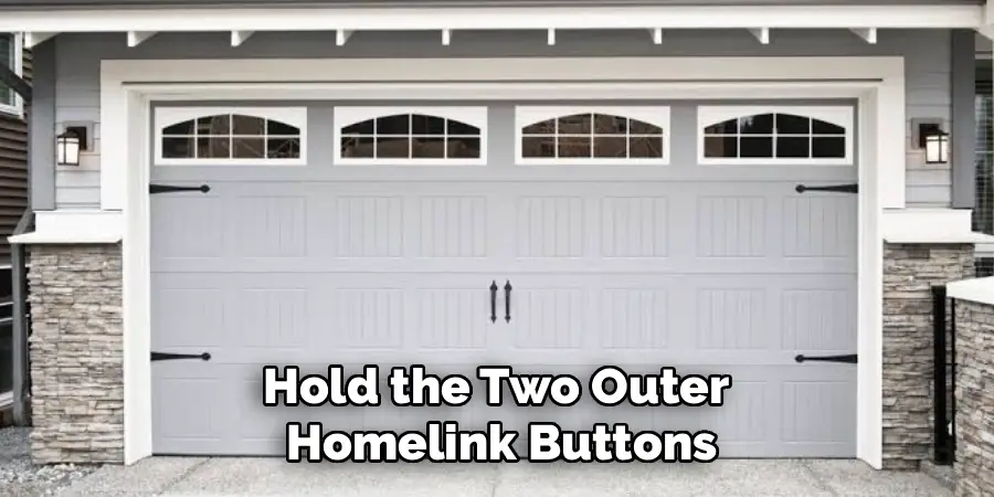 Hold the Two Outer
Homelink Buttons