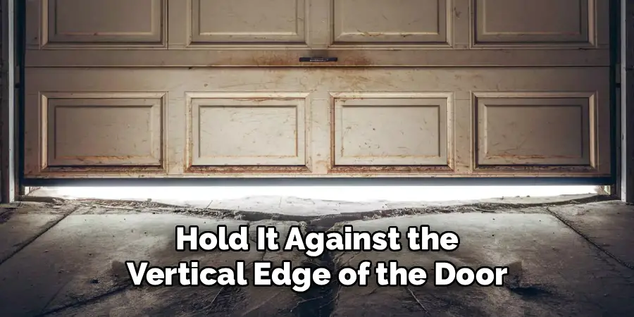  Hold It Against the 
Vertical Edge of the Door