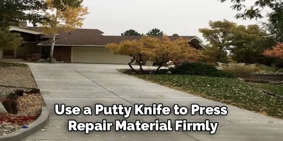 Use a Putty Knife to Press 
Repair Material Firmly