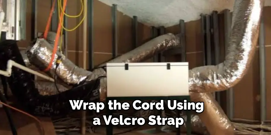 Wrap the Cord Using
 a Velcro Strap